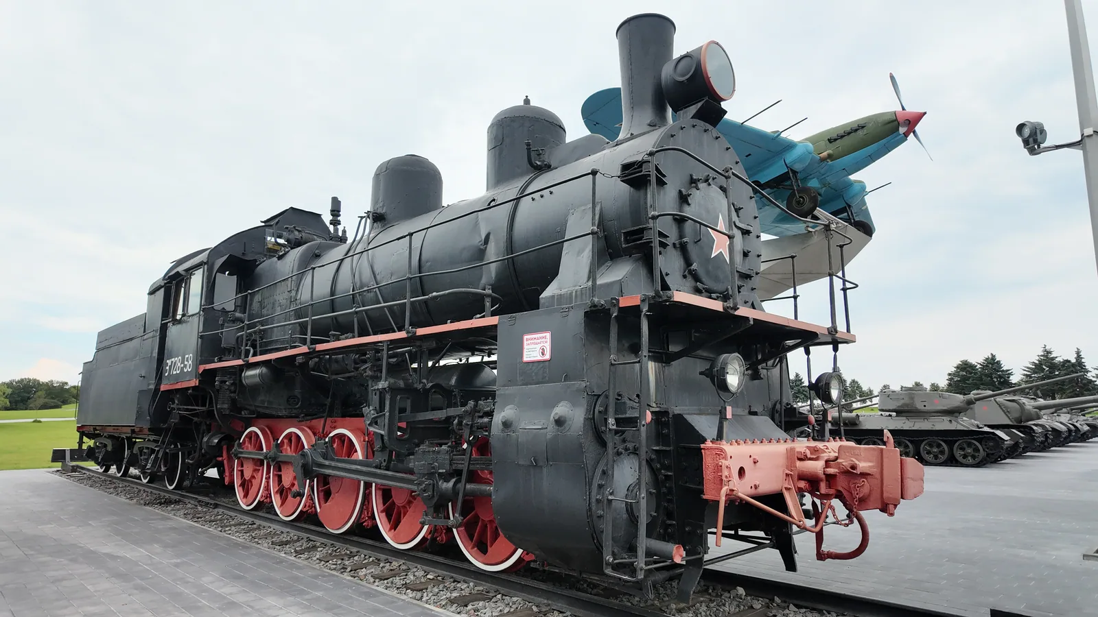 A preserved black steam locomotive photographed near Bykhov