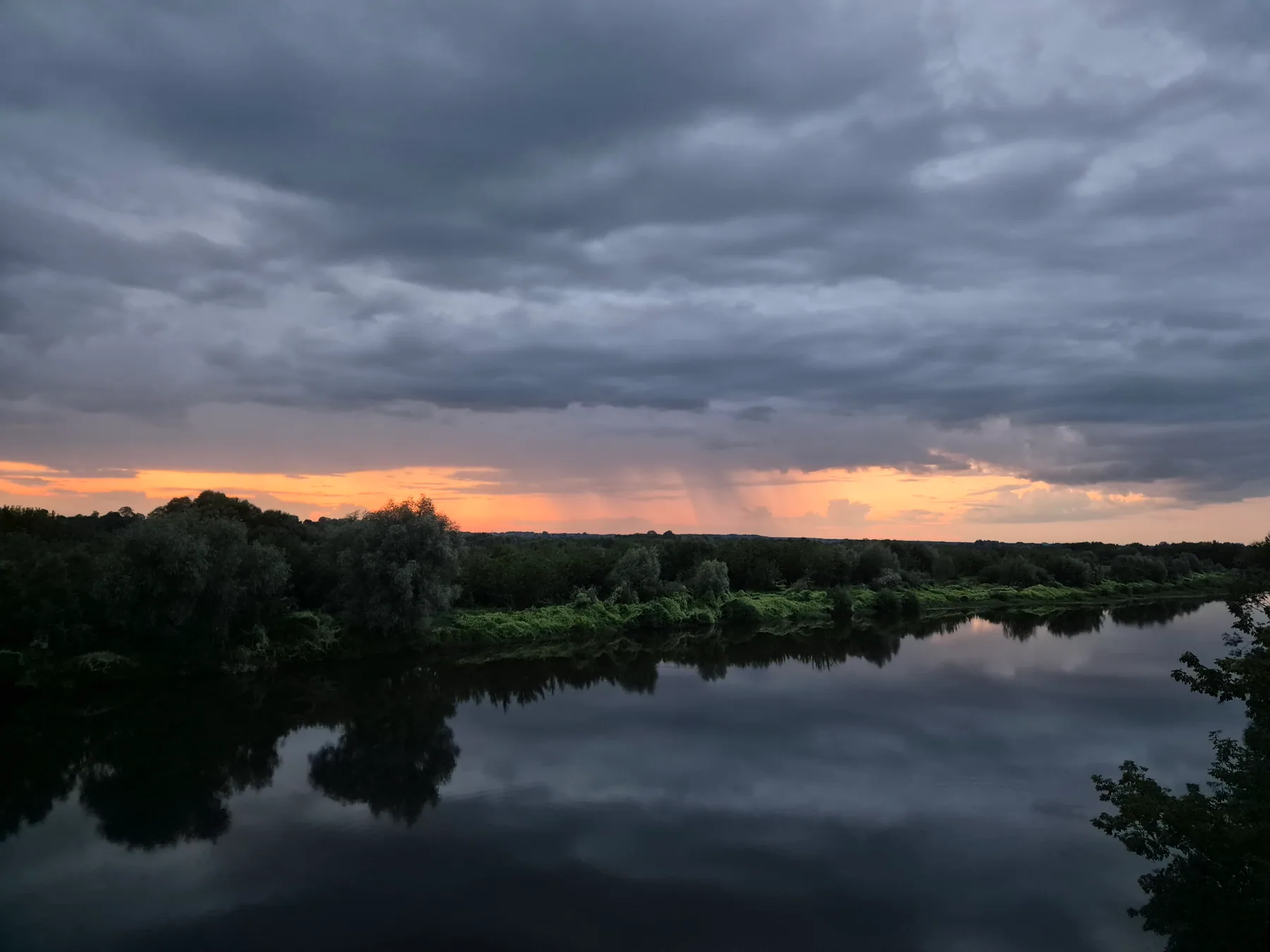 Storm clouds reflected in the river near Bykhov